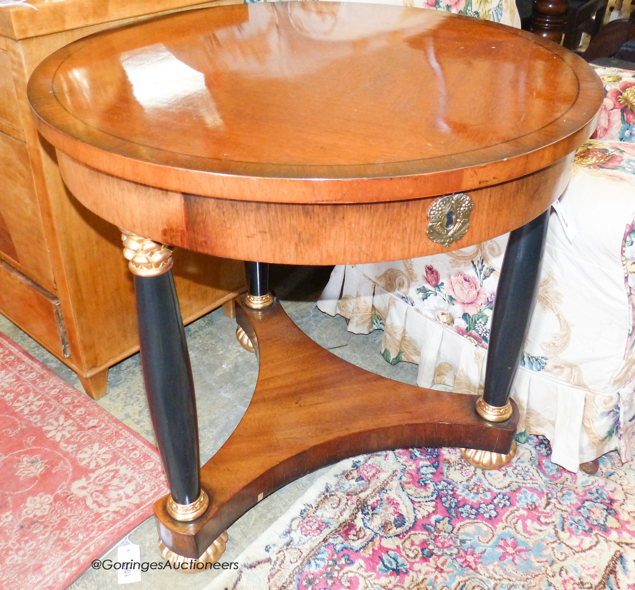 A reproduction French Empire style circular mahogany centre table, diameter 76cm, height 73cm
